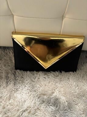 Aldo Black and Gold Metallic Triangle Clutch
